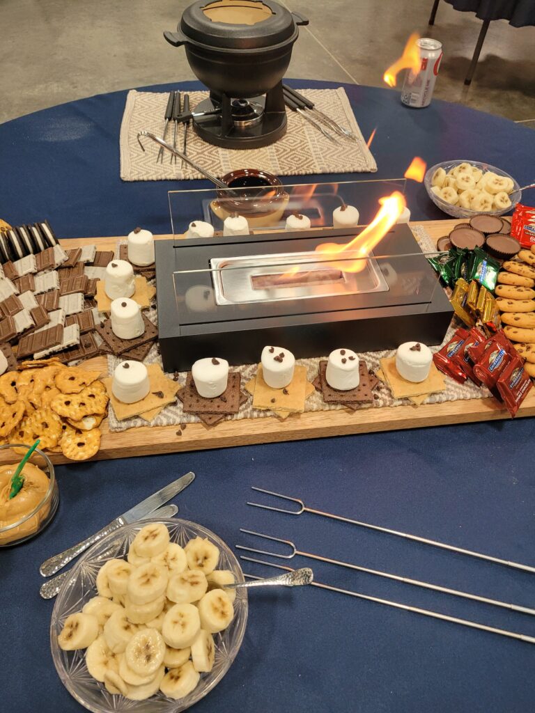 Tabletop fireplace on a s'mores board.